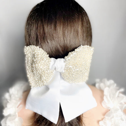 Back of the head large white bridal bow with pearls